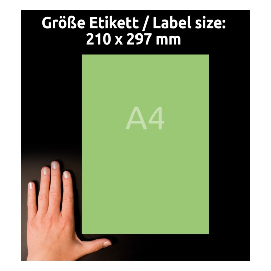 A képen egy kéz látható, amely egy 'A4' feliratú zöld papírlapot tart, amelynek méretei 210 x 297 mm, fekete háttér előtt.