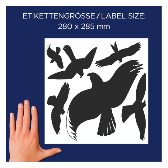 A képen különböző repülő madarak sziluetttervei láthatók, sötétkék háttéren. A szöveg a címke méretét 280 x 285 mm-ként jelzi, és egy emberi kéz látható a mérőskála érdekében.