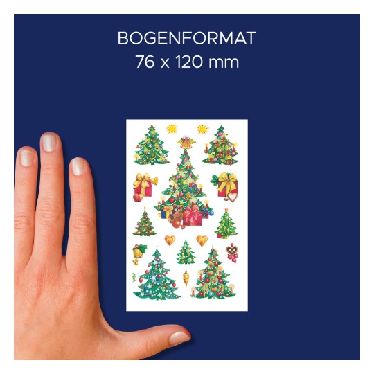 A képen egy kéz látható, amely különböző karácsonyfa mintákkal, ajándékokkal és díszekkel ellátott matricás ívet tart. Az ív méretei 76 x 120 mm, sötétkék háttérrel.