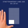 A kép egy kéz látszik egy címkelap mellett, a címkék mérete 38 x 29 mm, ami felül van megadva.
