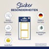 A kép egy aranyhatású design matricákat bemutató csomagot ábrázol. Négy fő jellemzőt emel ki: könnyen felcímkézhető, könnyen eltávolítható, Németországban készült és fenntartható papírból készült. A matricák fehér háttérrel és arany szegéllyel vannak tervezve.