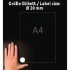A kép egy kézzel és egy A4-es méretű papírral van ábrázolva, a címke mérete Ø 30 mm. A háttér sötét, és fehér színű szövegek találhatók rajta német és angol nyelven, amelyek tájékoztatást adnak a címke méretéről.