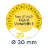 A kép egy kör alakú mérőt mutat, amely 20-as mérést jelöl, valamint a 'Geprüft nach DGUV Vorschrift 3' szöveget és egy 30 mm átmérőt.