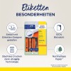 A kép az Avery Zweckform UltraGrip címkék csomagolását ábrázolja, kiemelve az olyan jellemzőket, mint az egyszerű tervezés egy online eszközzel, 100%-os átlátszatlanság és környezetbarát papír. Emellett említi az UltraGrip technológia előnyeit a gondtalan nyomtatás érdekében.