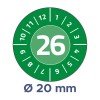 A képen egy kör alakú számlap látható, amelyen az 1-től 12-ig terjedő számok szerepelnek, a közepén pedig a 26-os szám jól láthatóan kiemelve. A számlap alatt egy megjegyzés található, amely 20 mm átmérőt jelöl, zöld háttér előtt.