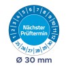 A képen egy kör alakú ütemterv látható, amely az ellenőrzési dátumokat jelzi, 'Nächster Prüftermin' felirattal, 30 mm átmérővel.
